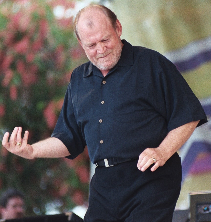'Cocker playing air guitar in Hallandale Beach, Florida, in 2003' by Carl Lender